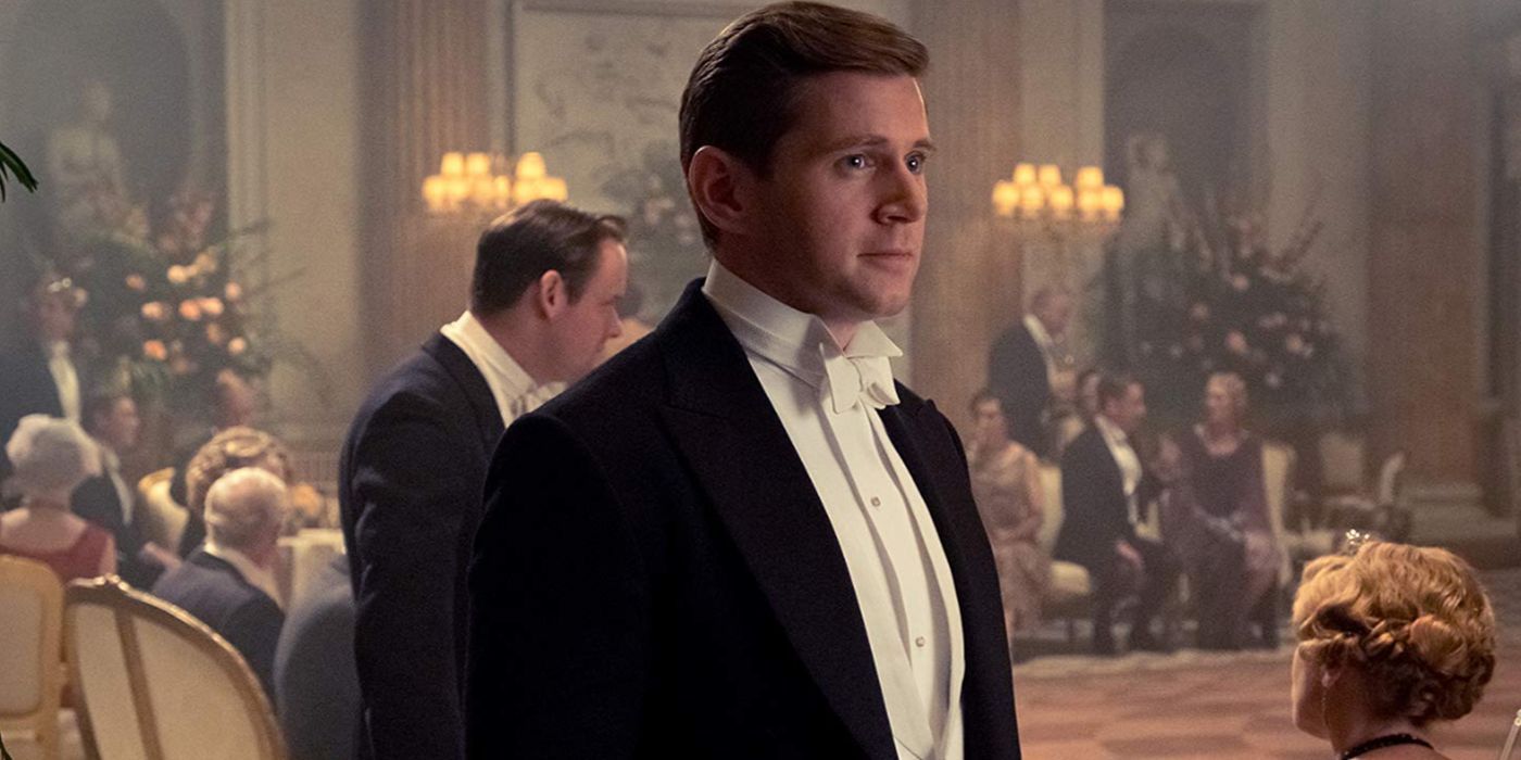Tom Branson wearing a tux and smiling faintly in Downton Abbey