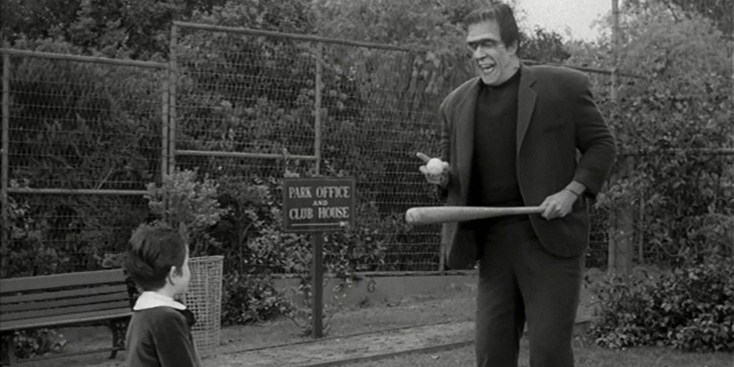 Fred Gwynne as Herman Munster and Butch Patrick as Eddit Munster in The Munsters