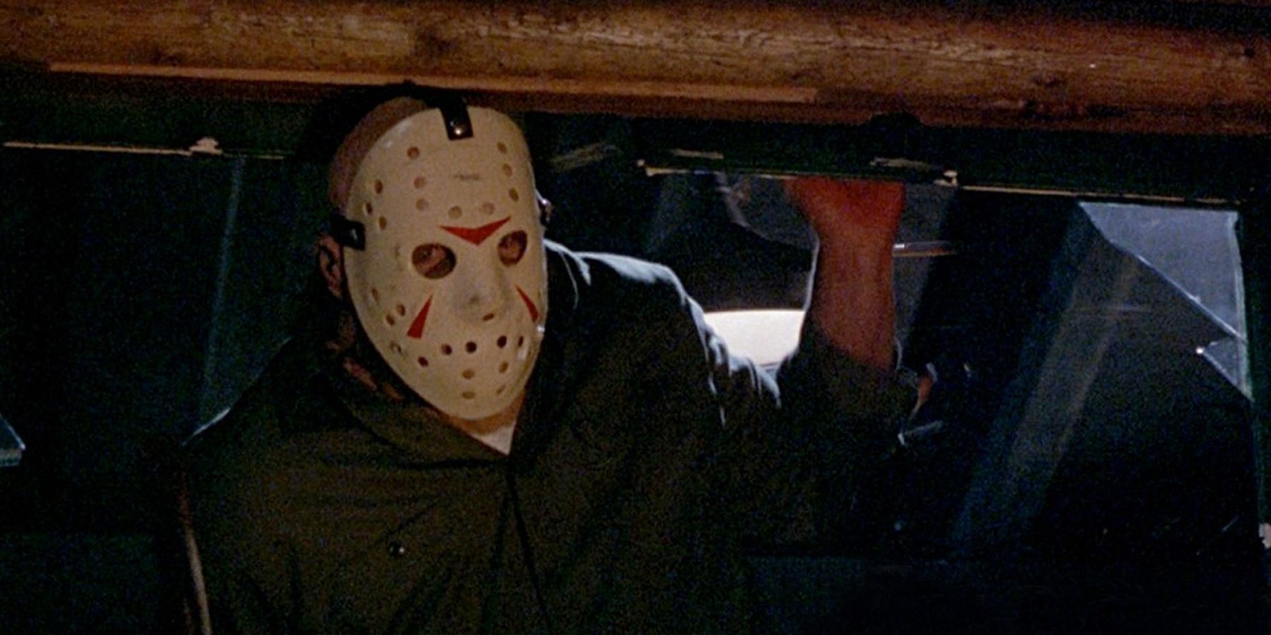 Jason Voorhees emerging through a window Friday the 13th Part 3 (1982)