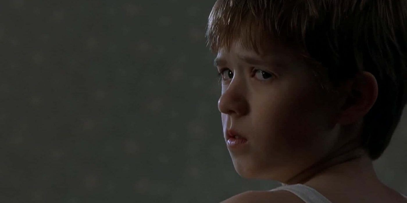 Haley Joel Osment looking serious in The Sixth Sense