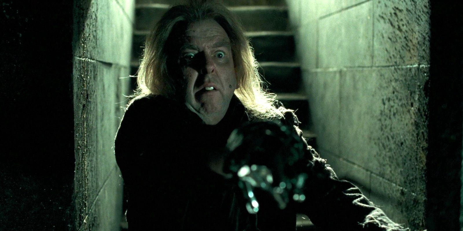 Petter Pettigrew standing in the doorway of the cellar of Malfoy Manor from Harry Potter