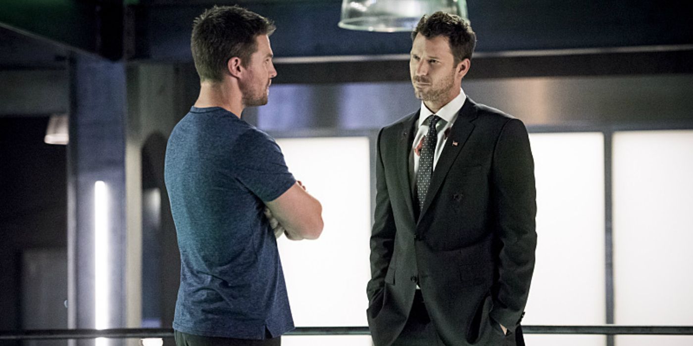 Oliver Queen talks with the Human Target in the bunker on Arrow