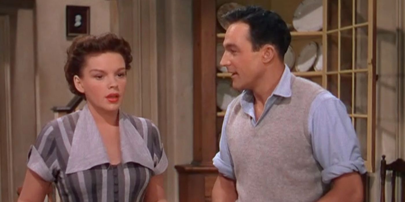Gene Kelly looks to his right at Judy Garland