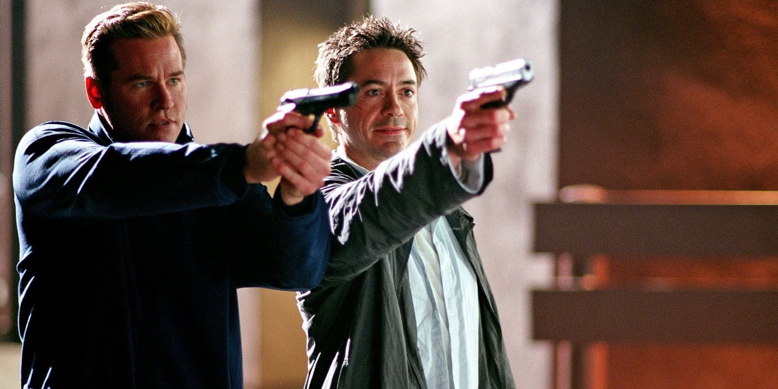 Harry and Perry pointing guns at Kiss Kiss Bang Bang