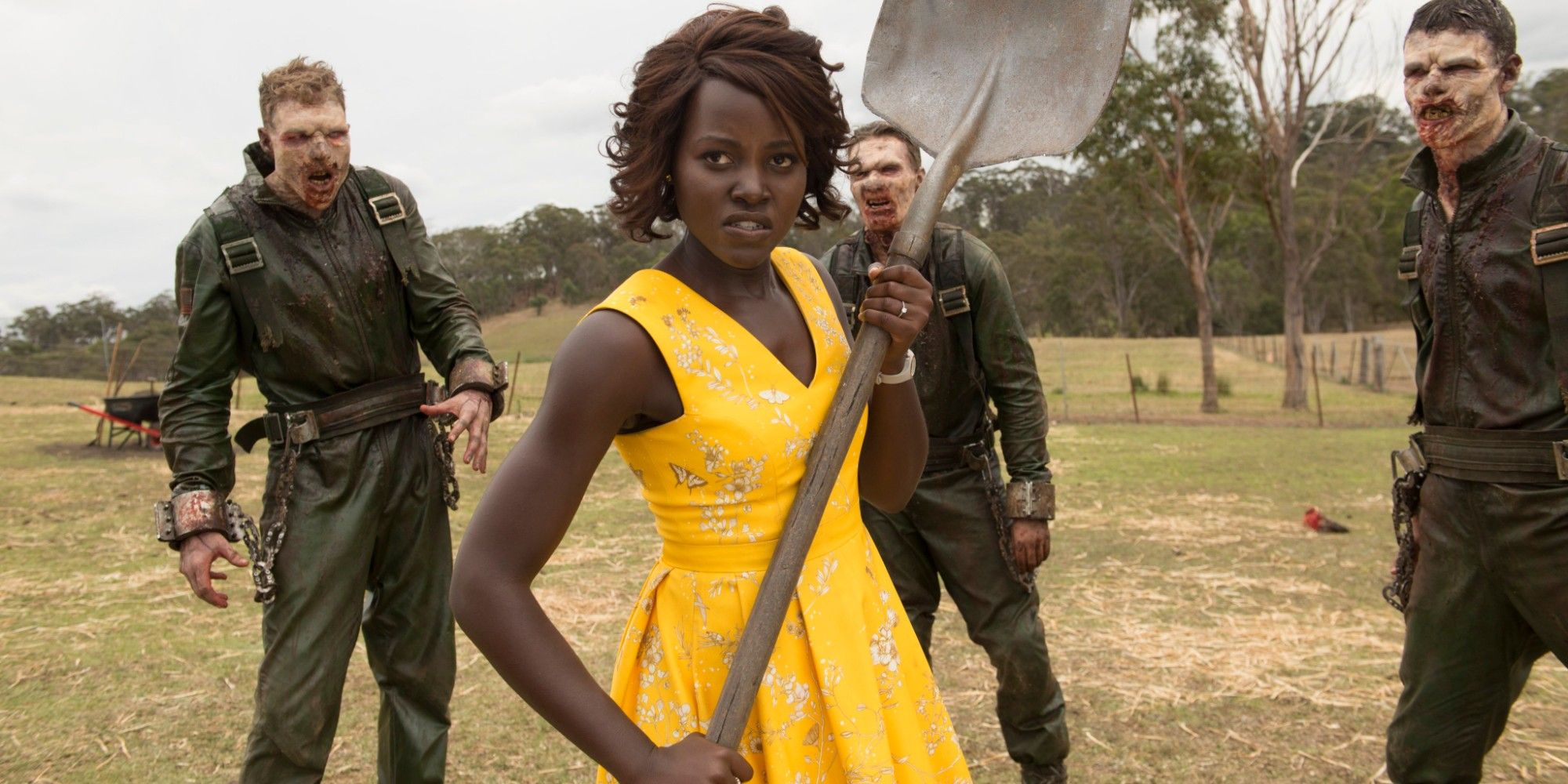 Lupita Nyong'o wielding a shovel against zombies in Little Monsters.