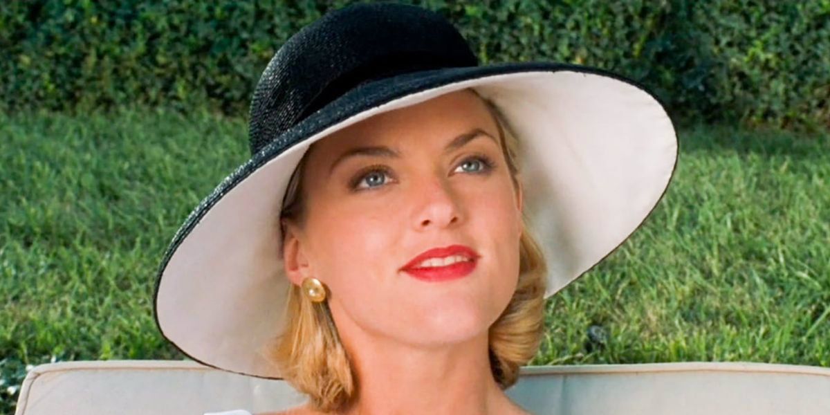 Meredith Blake smiling while wearing a hat outside in The Parent Trap
