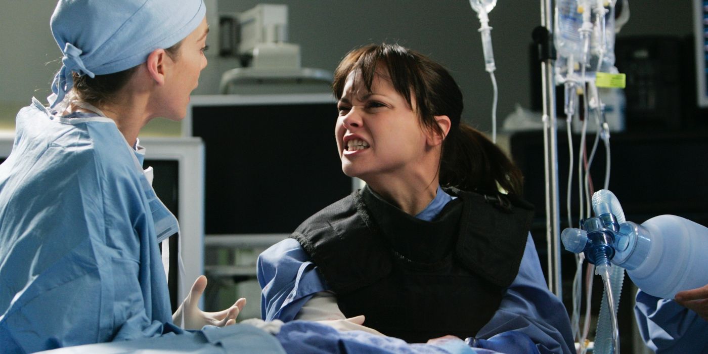 Meredith Grey (Ellen Pompeo) and Hannah Davies (Christina Ricci) with their hands on a bomb stuck in a man's chest