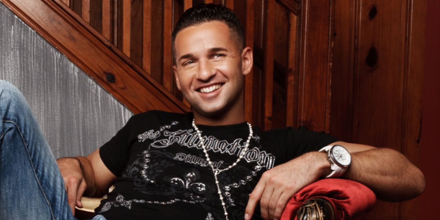 Mike &quot;The Situation&quot; Sorrentino from Jersey Shore sitting with his arm resting on the back of a chair.