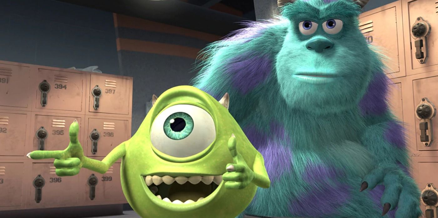 Mike and Sulley in Monsters Inc. looking off camera and smiling.