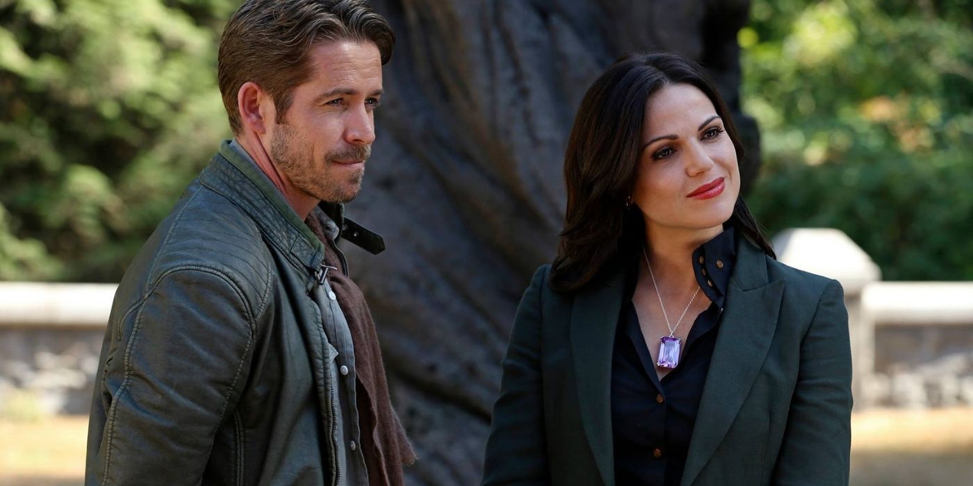 Once Upon a Time with Regina and Robin Hood standing outside.