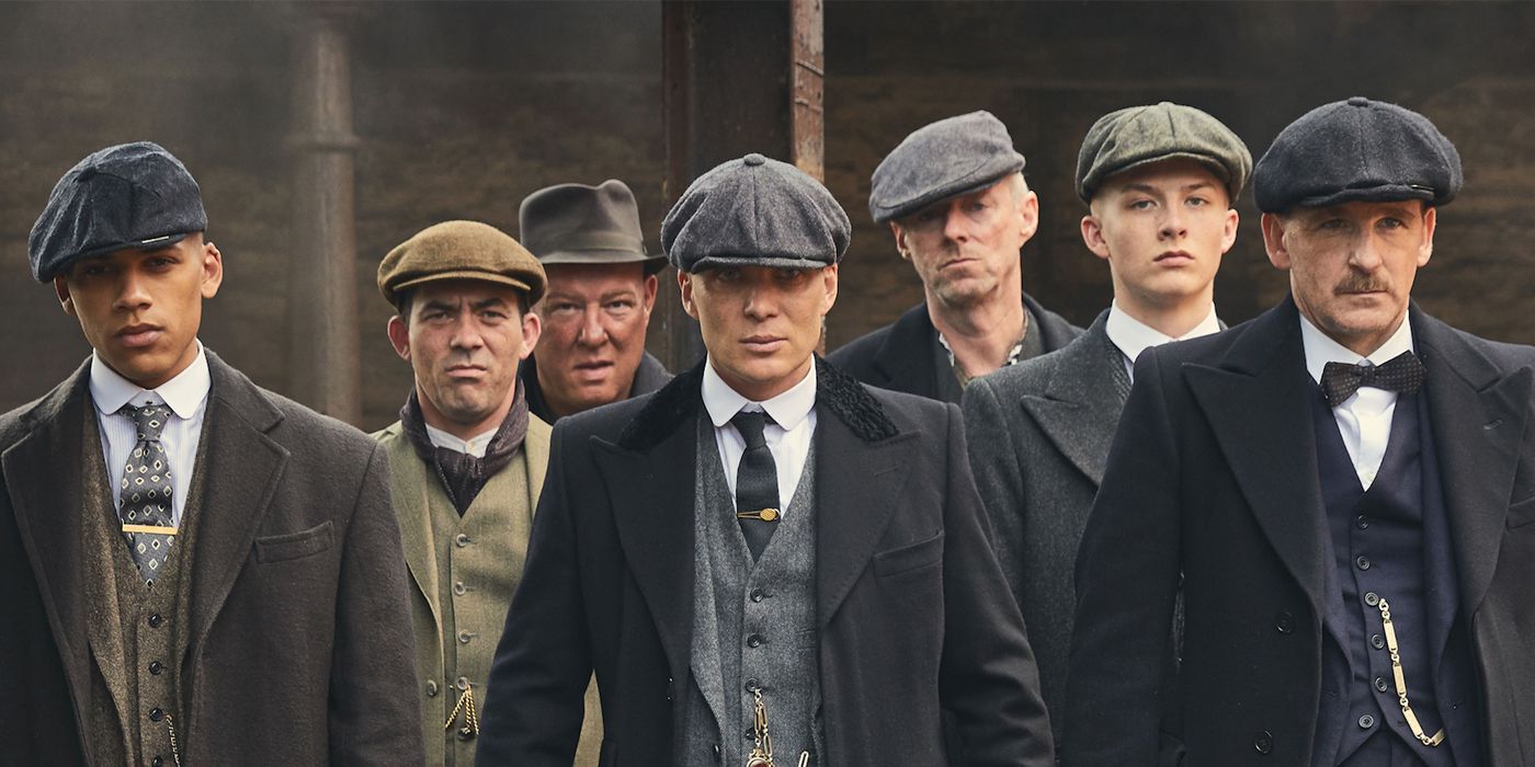 The Peaky Blinders walking together down the street