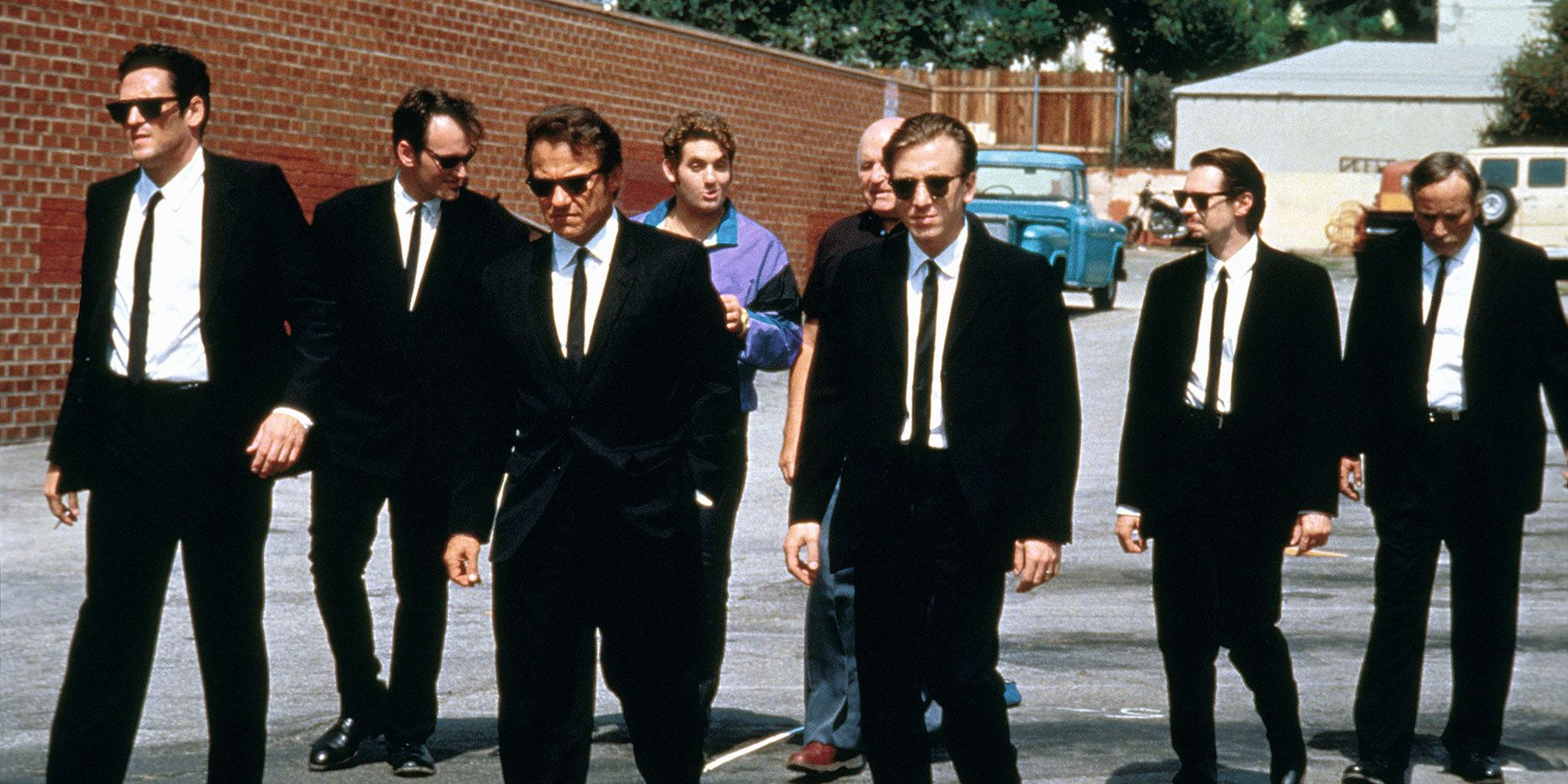 The cast of Reservoir Dogs in suits and sunglasses