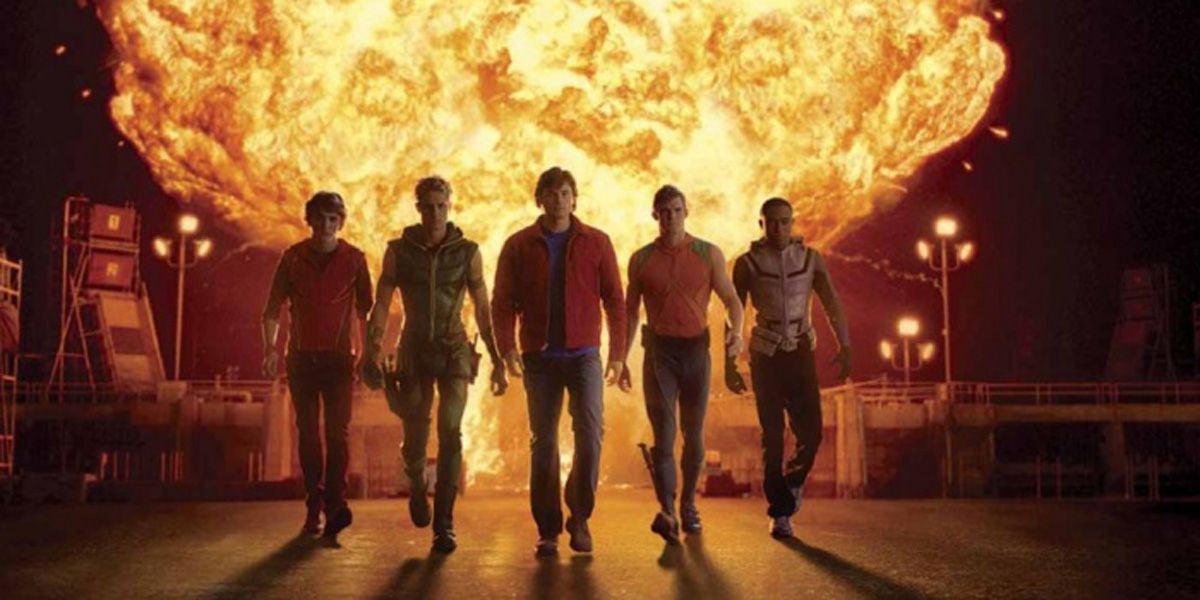 The Justice League walk away as a giant fireball erupts behind them in Smallville.