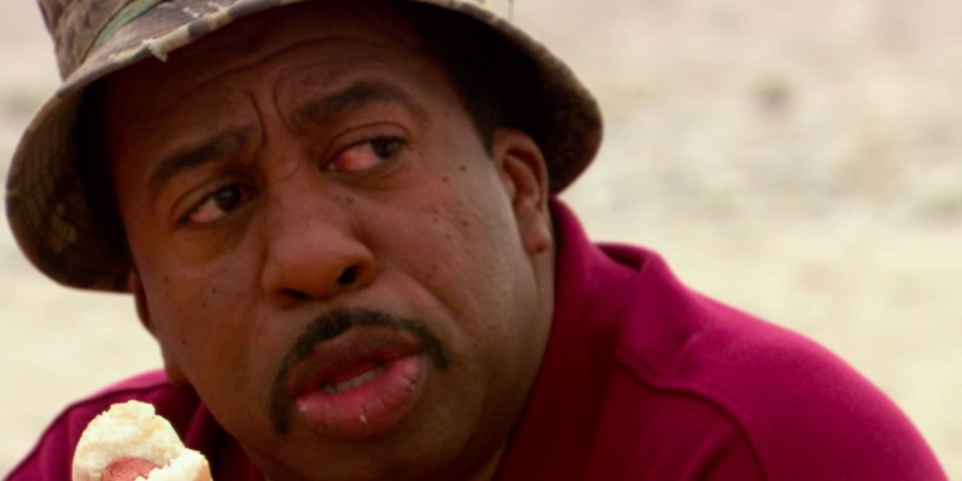Stanley eating a hot dog on 'Beach Games' on The Office
