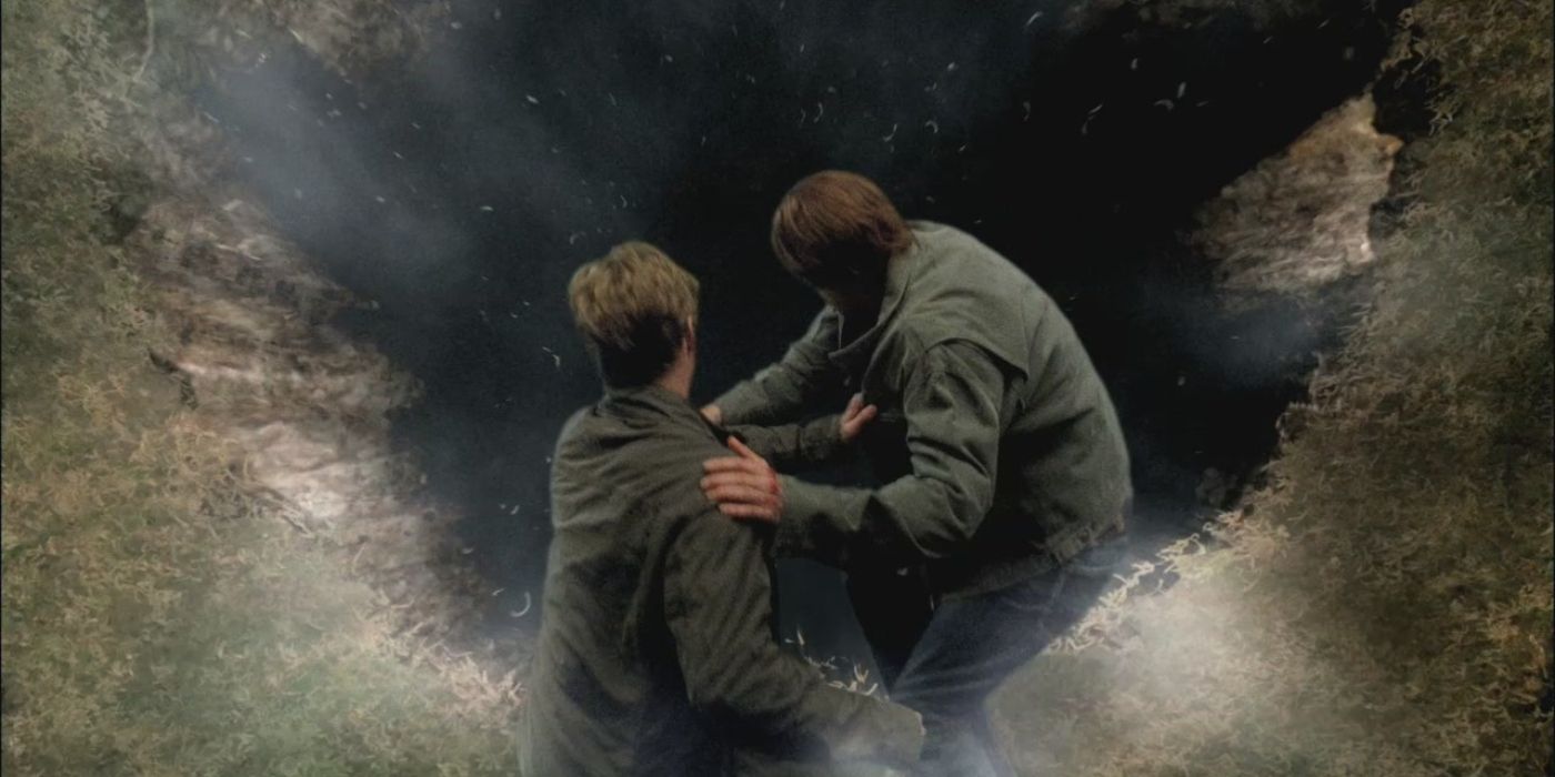 Dean and Sam looking down at a hole on Earth in Supernatural
