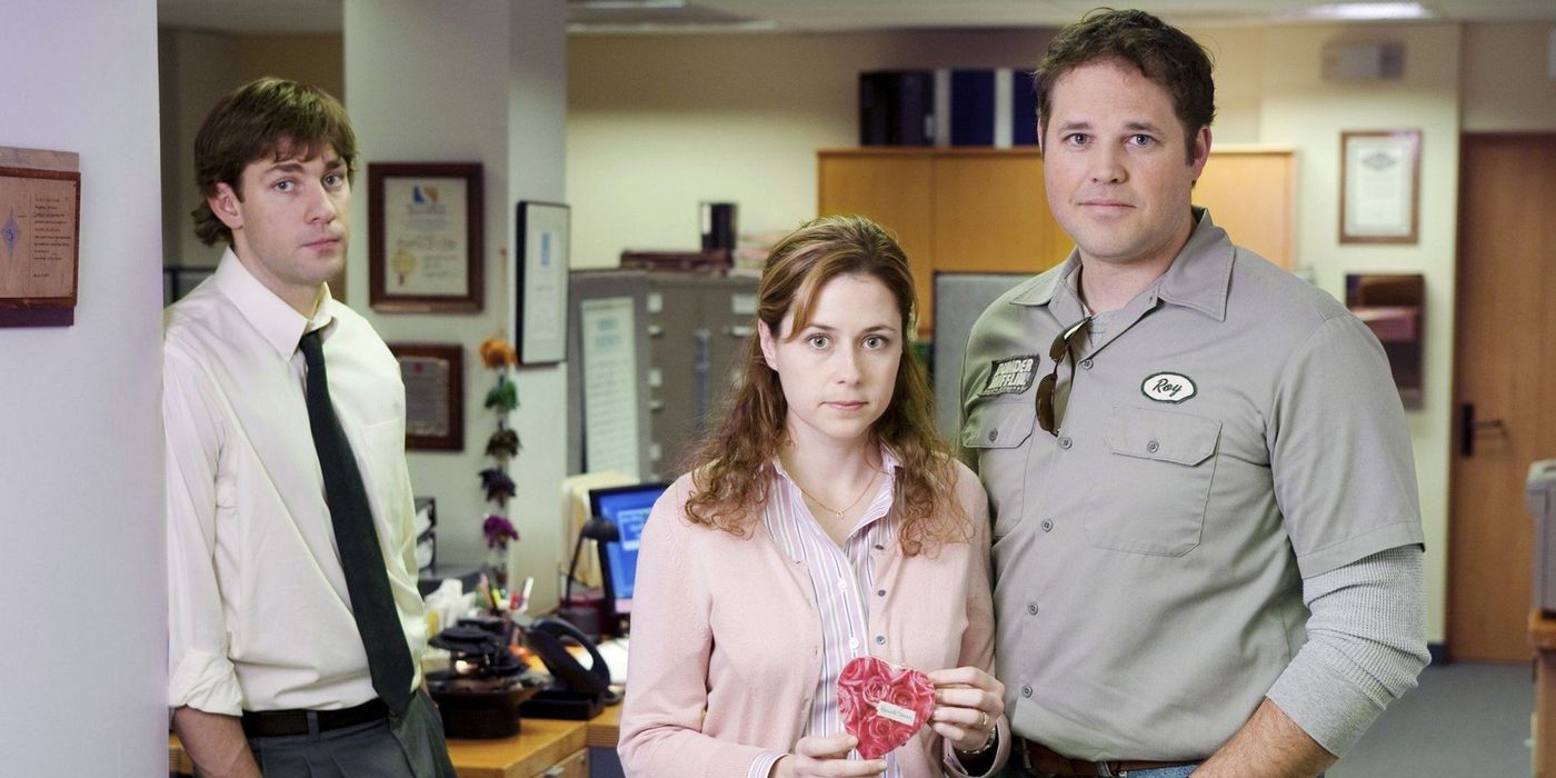 Jim stands off to the side of Pam and Roy in the Office.
