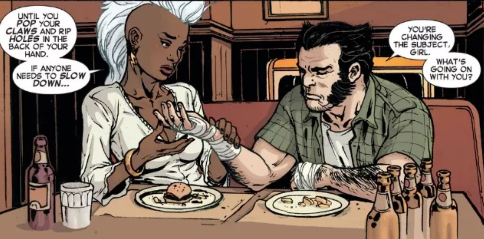 Wolverine And Storm sitting on a table