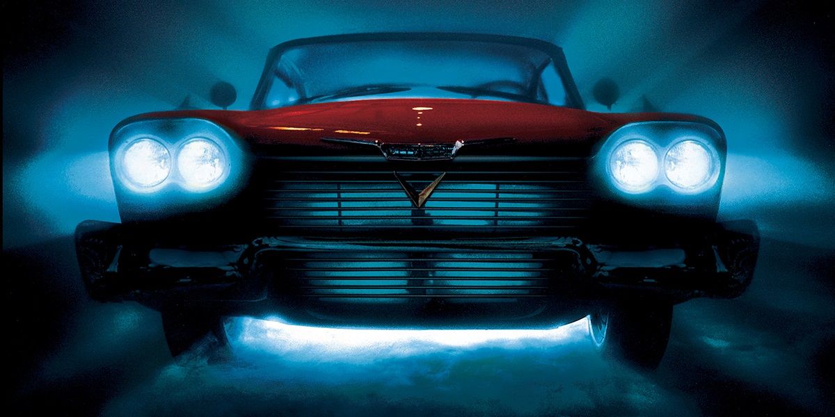 A close-up of the titular car in Christine on the poster