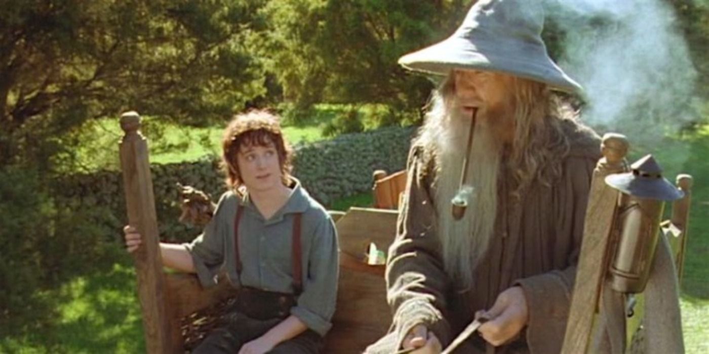 Frodo and Gandalf ride in a cart