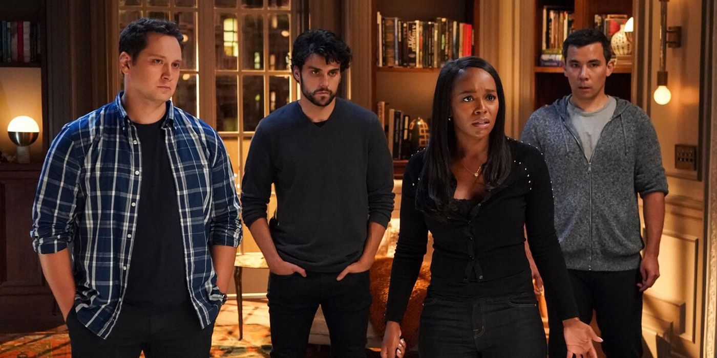 cast of how to get away with murder standing together and looking concerned off screen