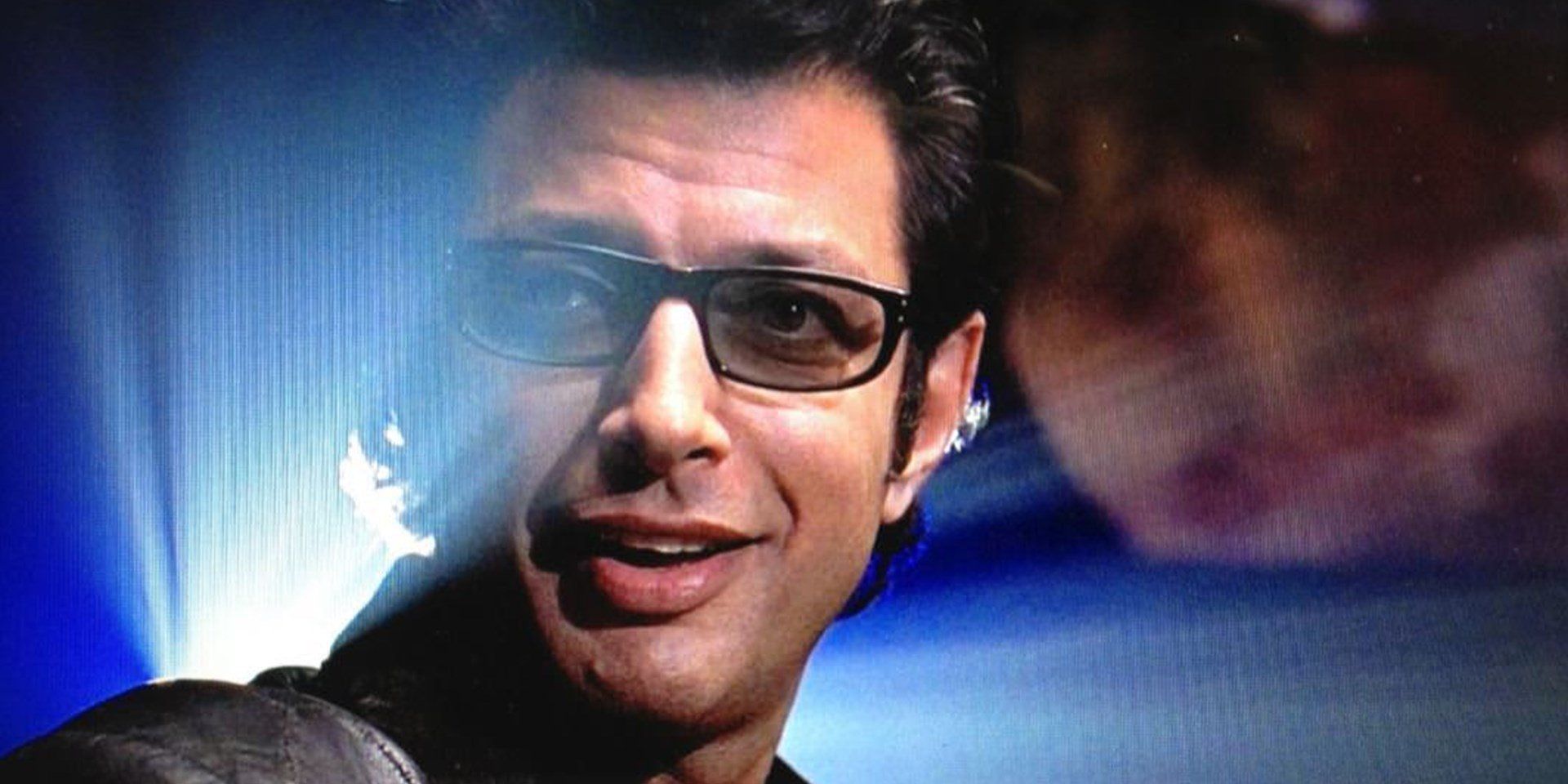 Jeff Goldblum as a smiling Dr. Ian Malcolm in Jurassic Park