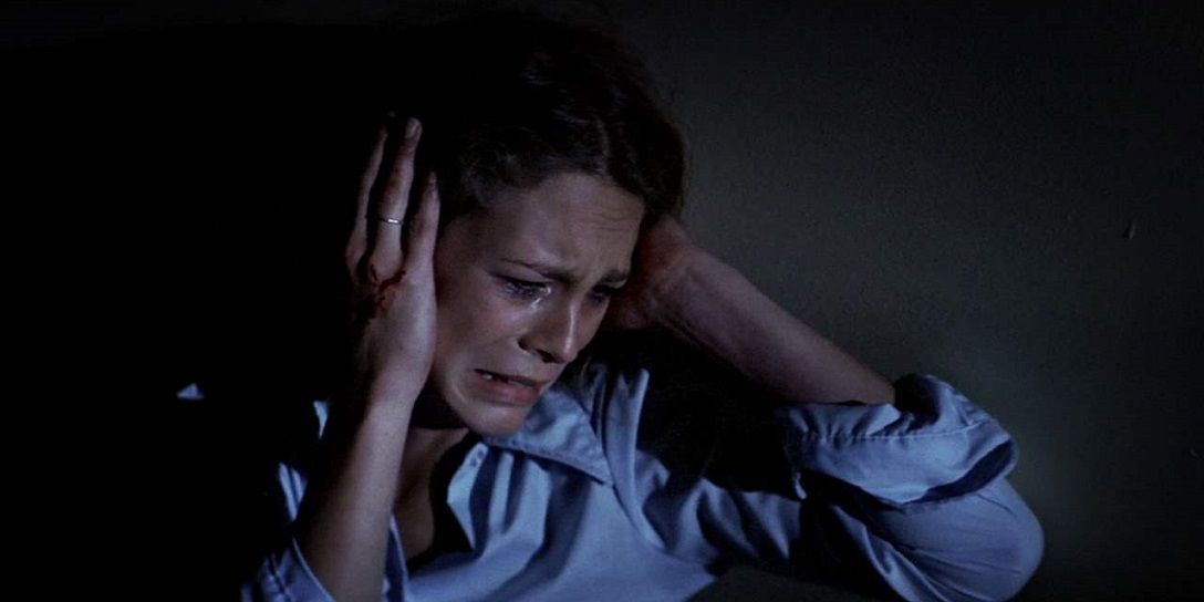 Laurie holding her head in fear in the original Halloween