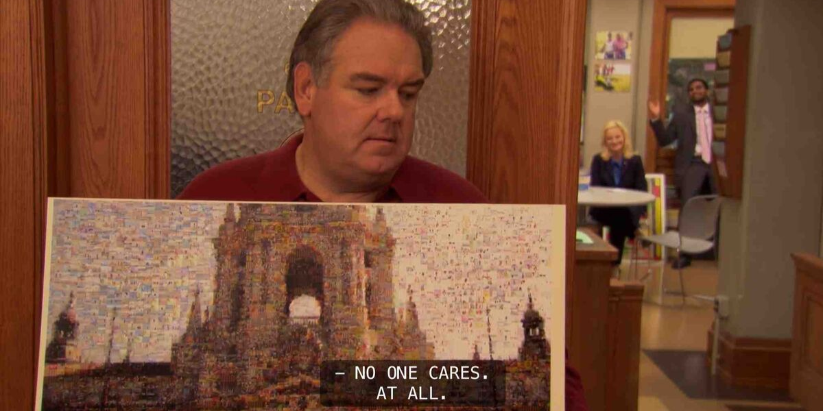 Jerry (Jim O'Heir) holding his town mural
