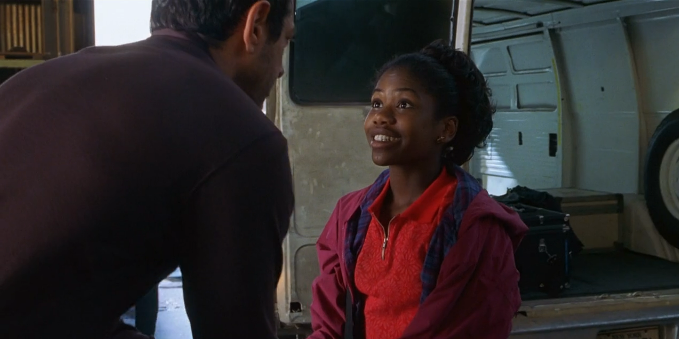 Kelly Malcolm in The Lost World smiling at Ian Malcolm