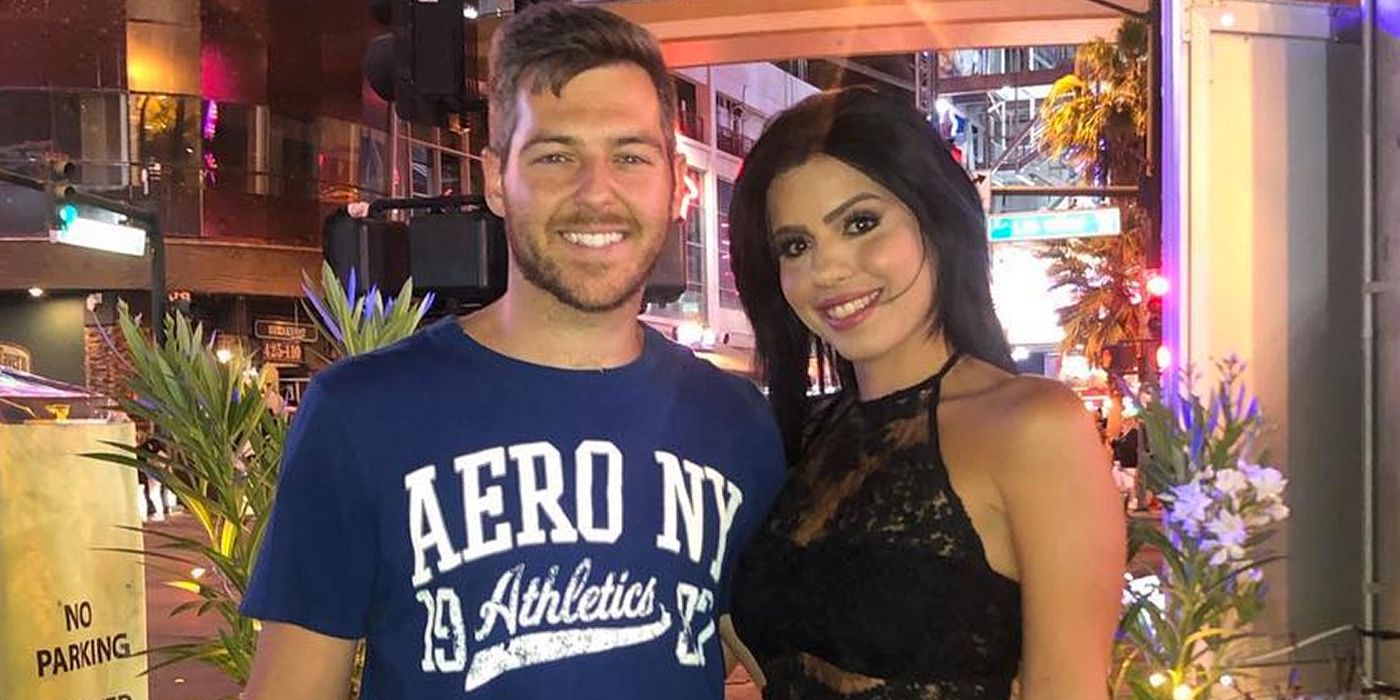 90 Day Fiancé's Larissa Lima and Eric Nichols smiling together at christmas