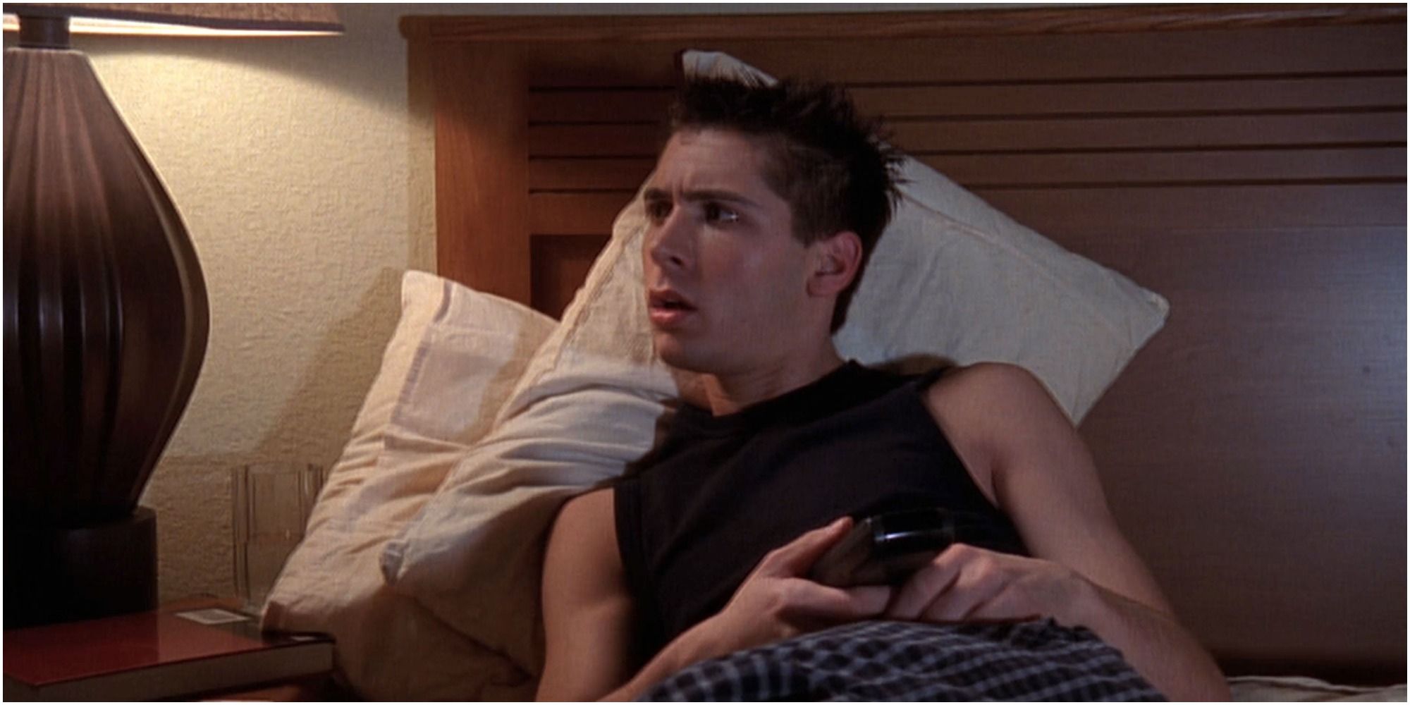 Reese in bed in his apartment in Malcolm In The Middle