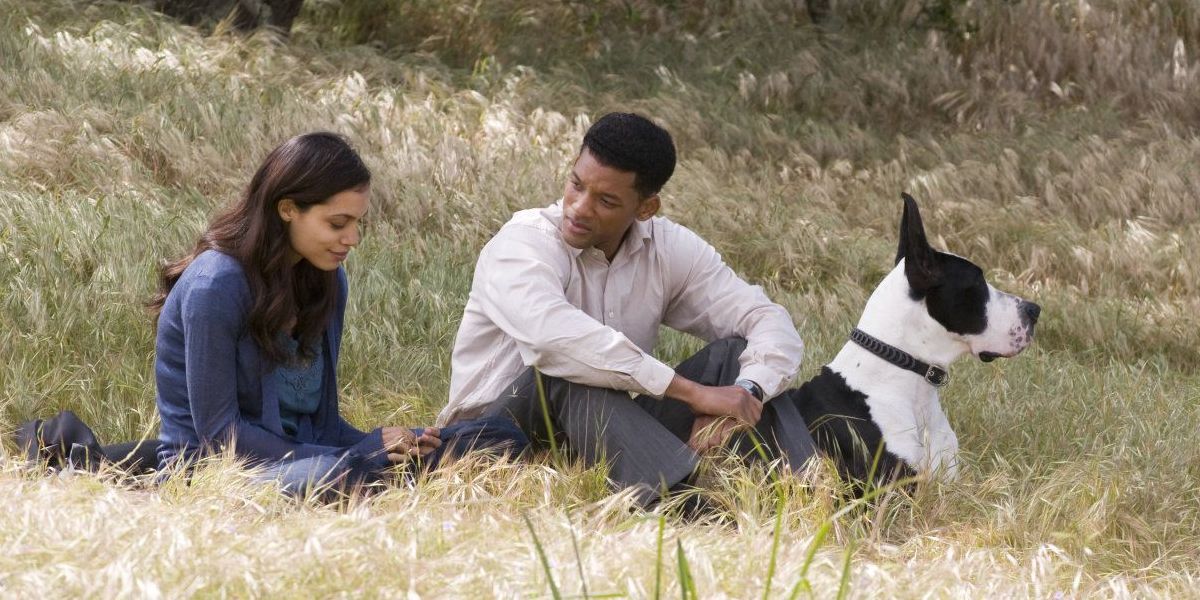 Rosario Dawson and Will Smith sitting on a hilsside and talking in Seven Pounds