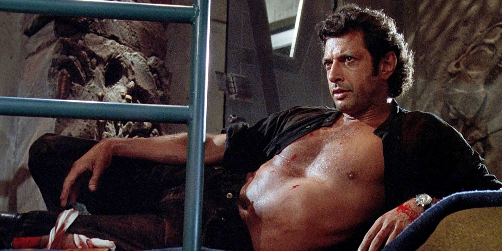Ian Malcolm lying shirtless in Jurassic Park