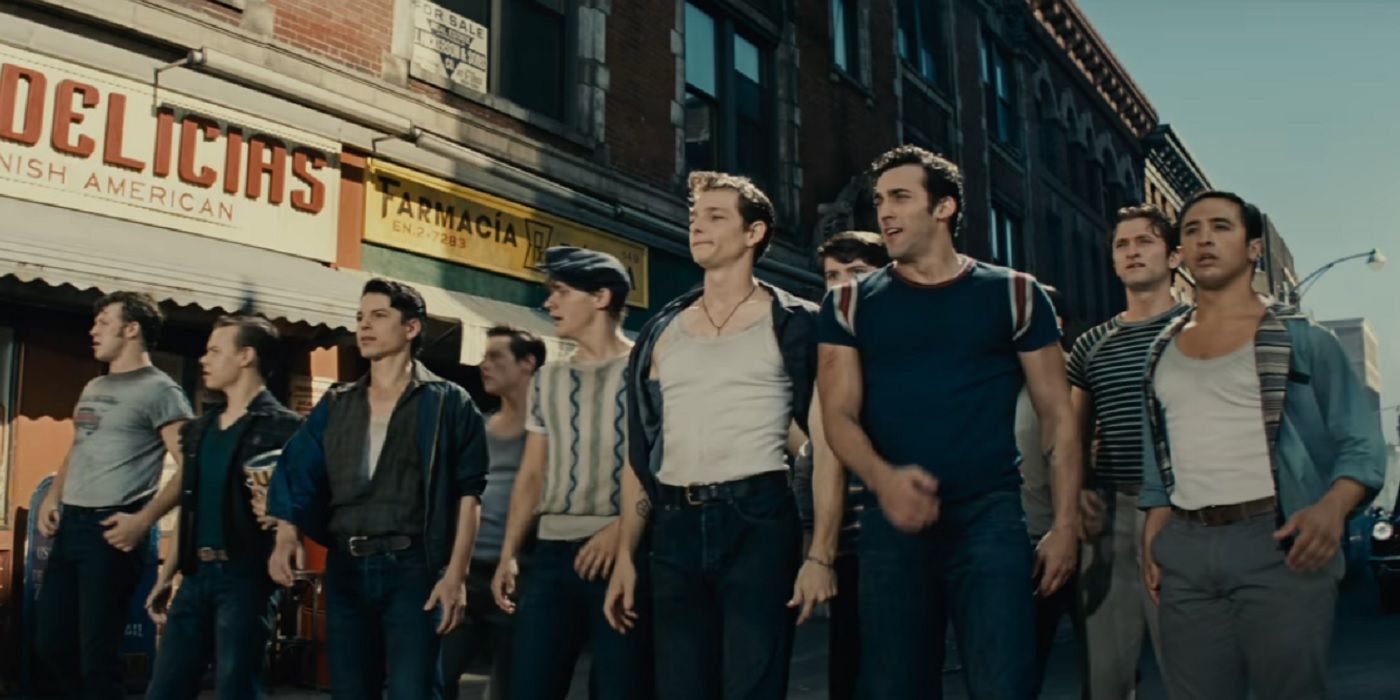 The Jets walk down the street in West Side Story (2021)