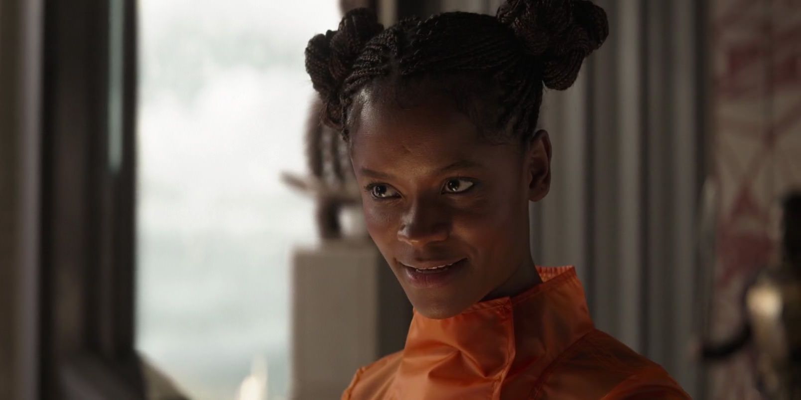 Shuri smiles while she speaks in Black Panther
