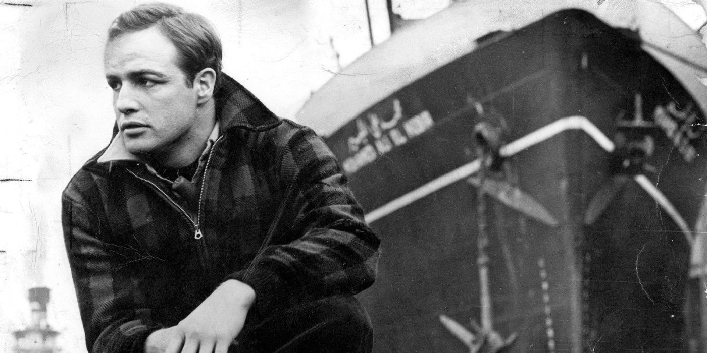 Marlon Brando, as Terry Malloy, kneels down in On The Waterfront