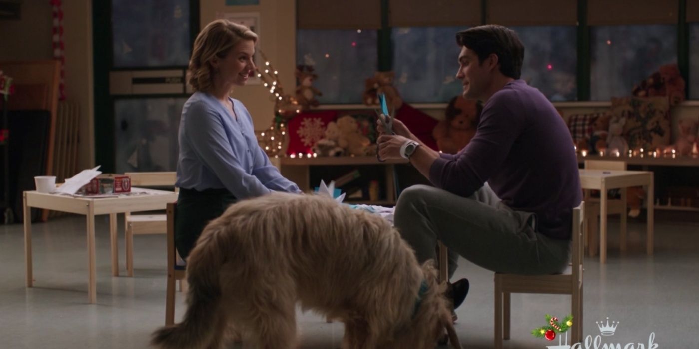 Darcy and Aiden talk with a dog at their feet in A Gift To Remember