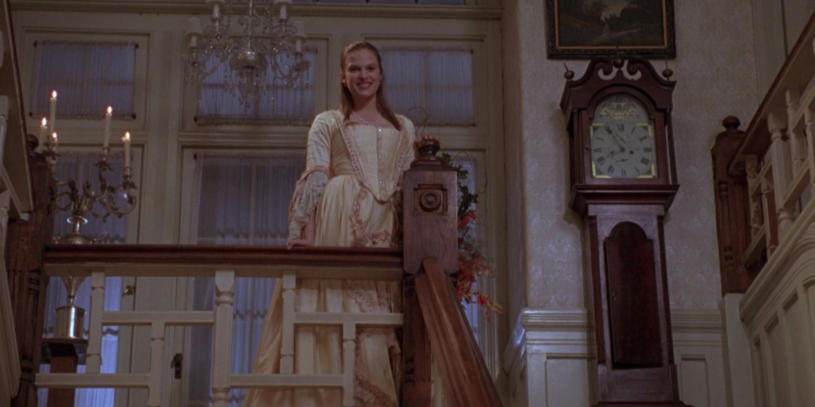 Allison stands at the top of a staircase in costume in Hocus Pocus