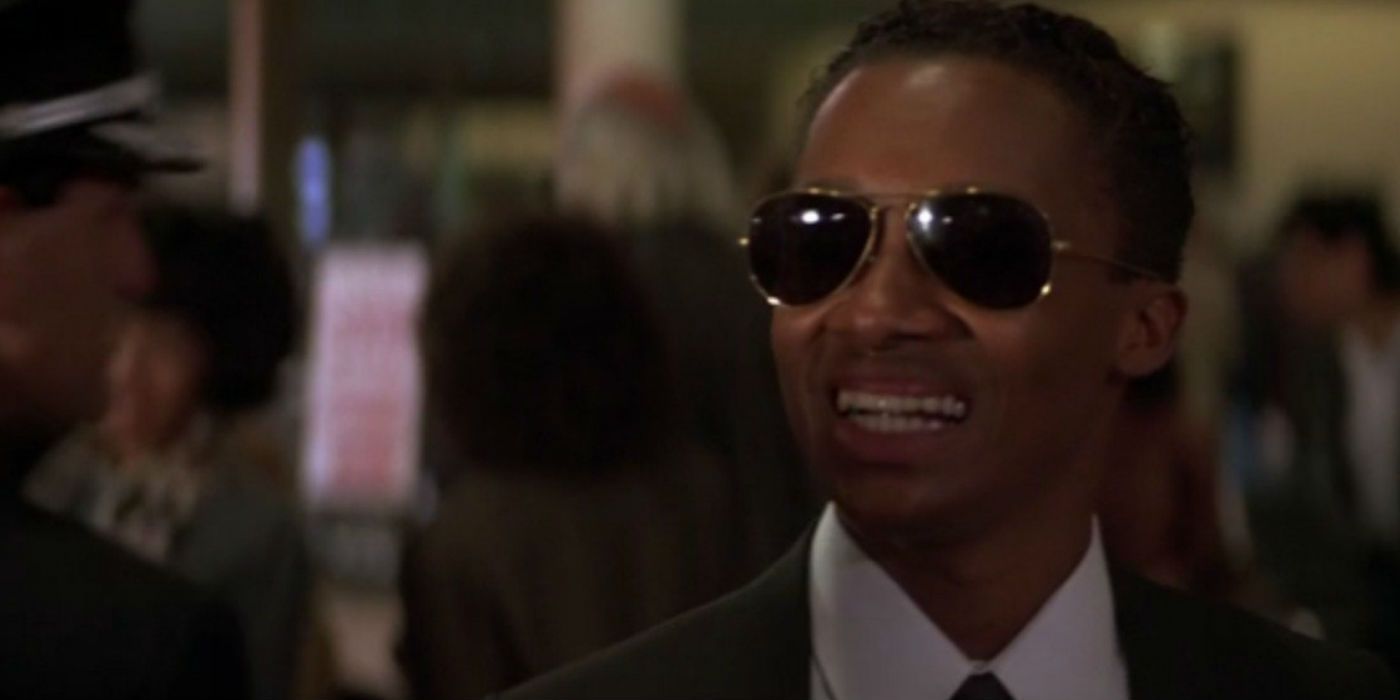 Argyle smiling with sunglasses on in Die Hard