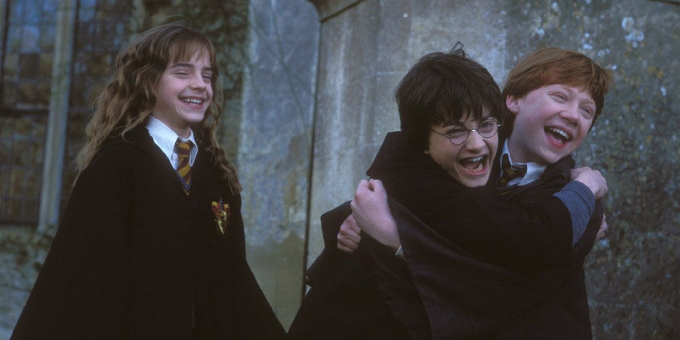 The golden trio hugging in Harry Potter