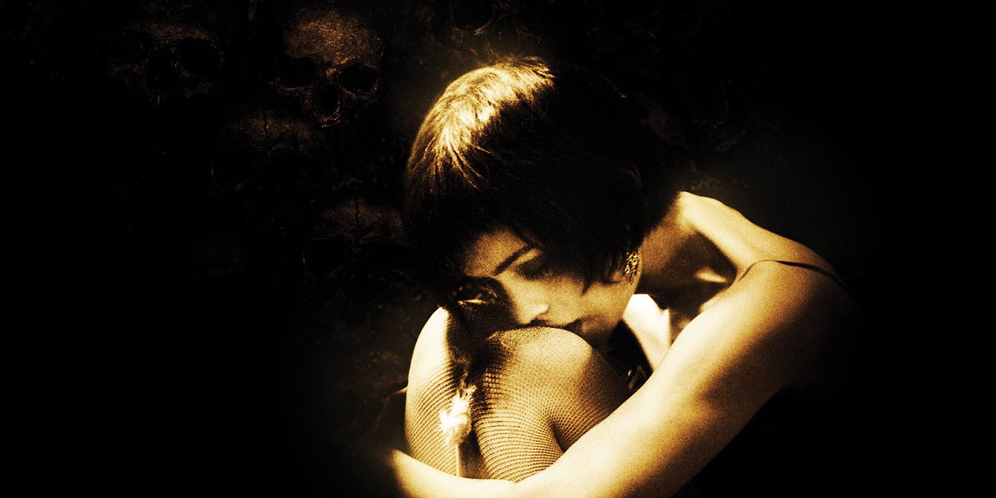 A woman huddled alone in the dark in a cropped poster for Catacombs 2007