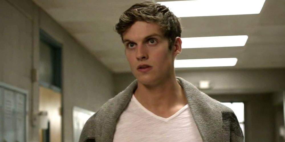 Isaac stands in the school hallway in Teen Wolf