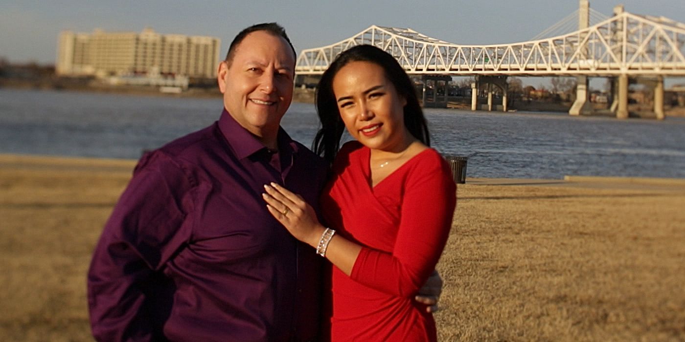 David and Annie 90 Day Fiance smiling outside in front of bridge