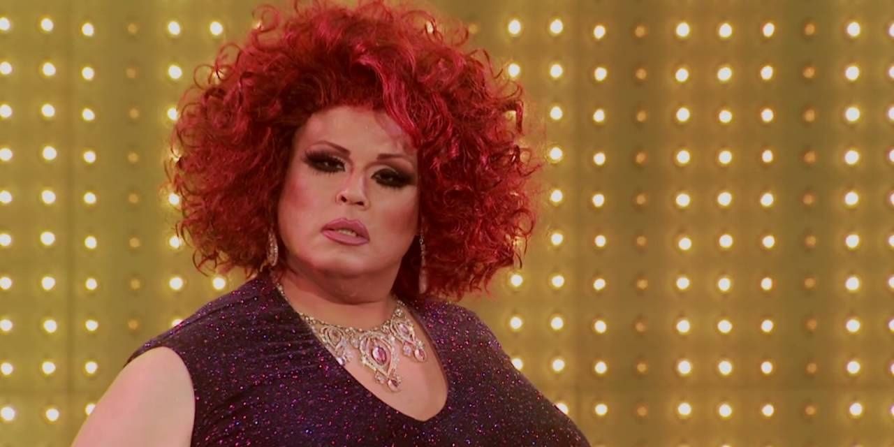Delta Work on RuPaul's Drag Race Mainstage in red wig