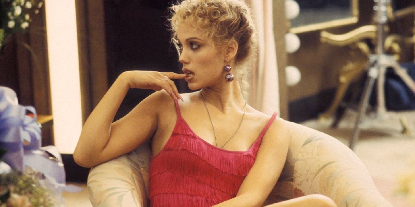 Elizabeth Berkley bites her nail in Showgirls