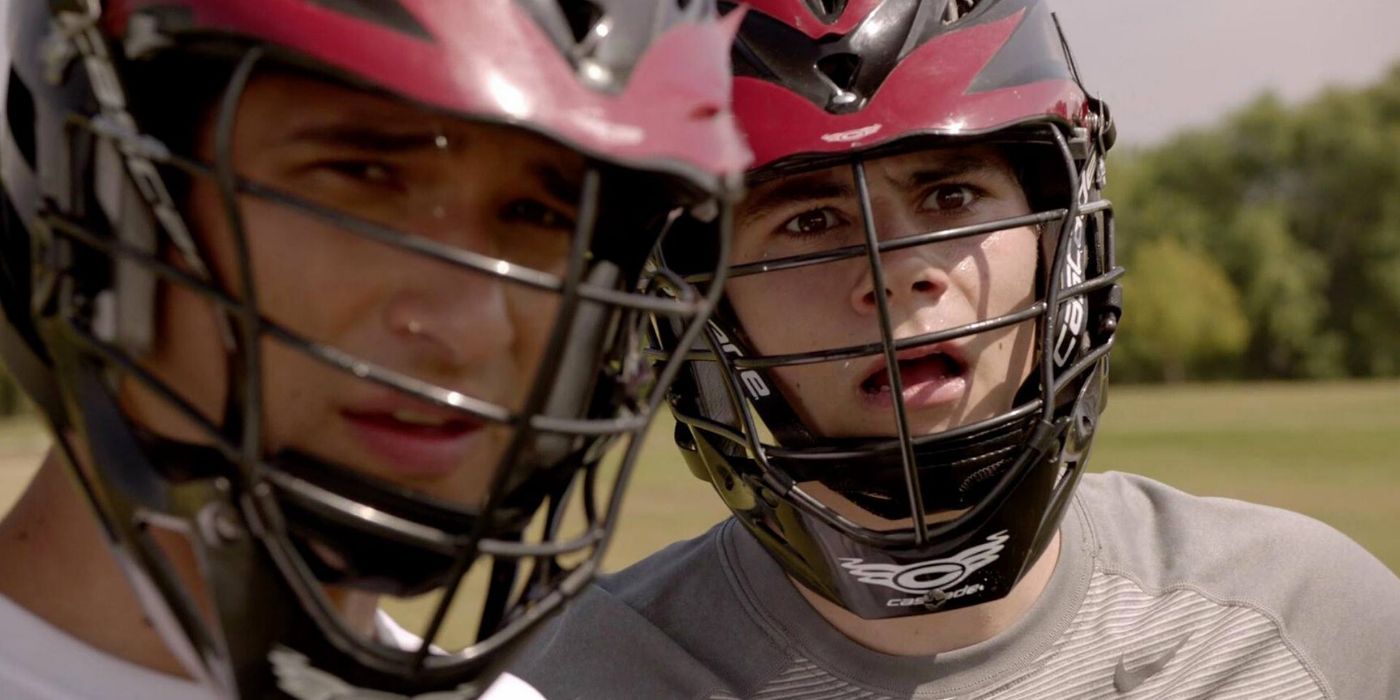 Tyler Posey and Dylan O'Brien as Scott and Stiles playing lacrosse in Teen Wolf.