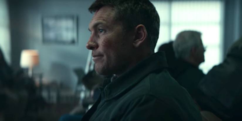 Ray (Sam Worthington) looking sideways in Fractured