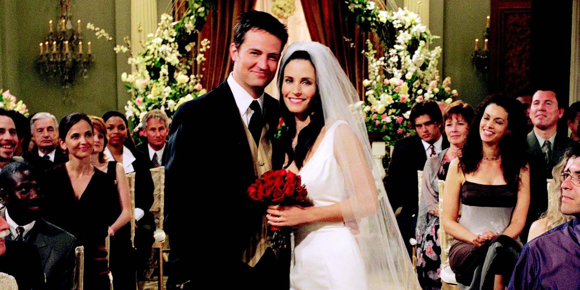 Chandler and Monica pose for a photo after their wedding in Friends
