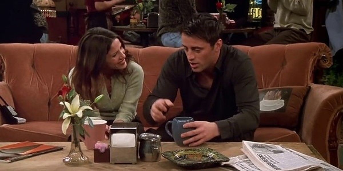 Katie and Joey chat at the coffee house in Friends
