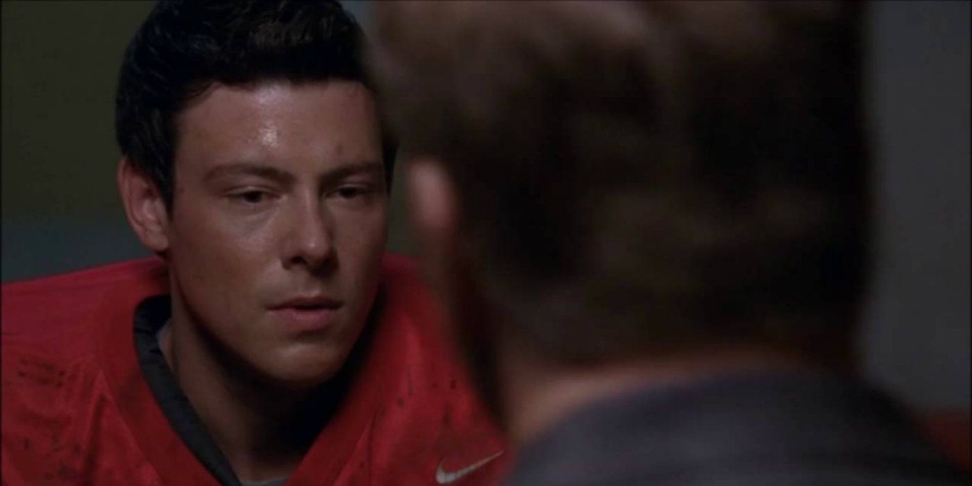 Finn looking scared while talking to someone in Glee.
