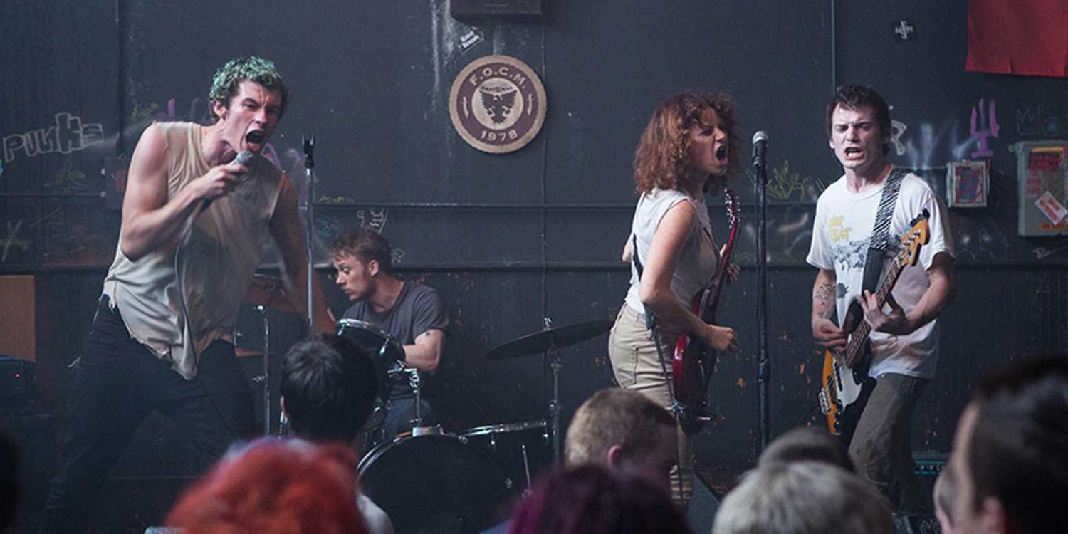 band playing on stage in green room